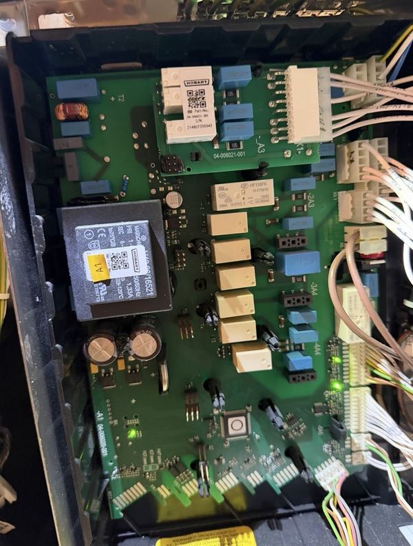 Catering equipment control board being checked for faults