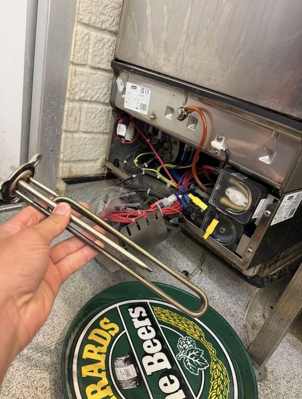 Burnt-out heating element removed from a commercial dishwasher