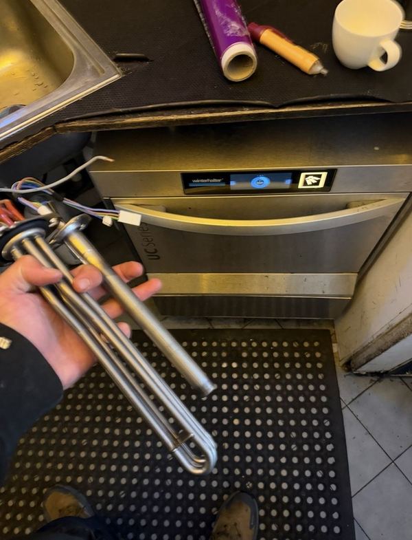 Old heating element removed from a glasswasher